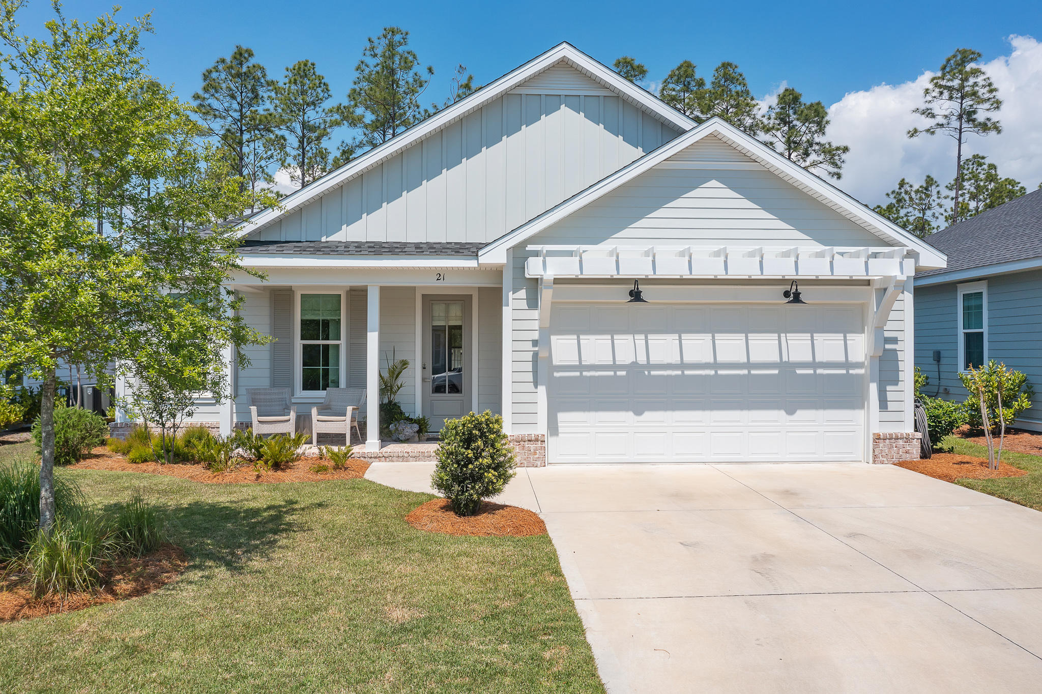 21 Windrow Way Inlet Beach Inlet Beach, FL 32461 - Photo 40 of 58 a front view of a house with a yard outdoor seating and barbeque oven