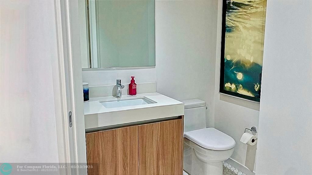 401 North Birch Road, Unit 415 Fort Lauderdale, FL 33304 - Photo 16 of 33 a bathroom with a sink and a toilet