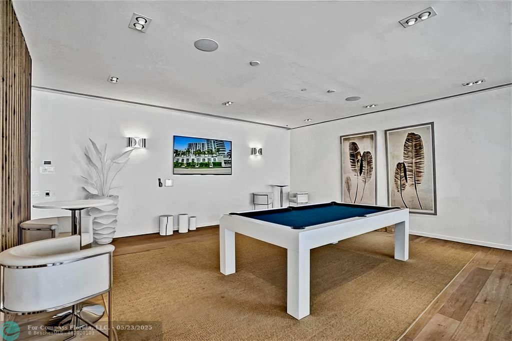 401 North Birch Road, Unit 415 Fort Lauderdale, FL 33304 - Photo 21 of 33 a room with table chairs and wooden floor