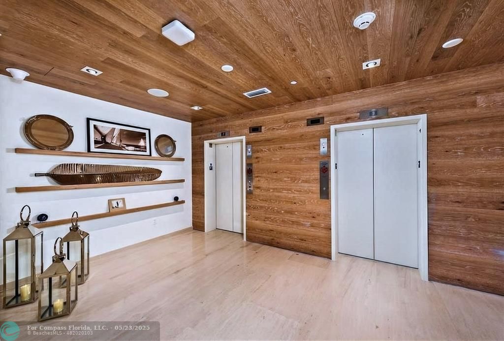 401 North Birch Road, Unit 415 Fort Lauderdale, FL 33304 - Photo 24 of 33 a hall with stainless steel appliances a stove and cabinets