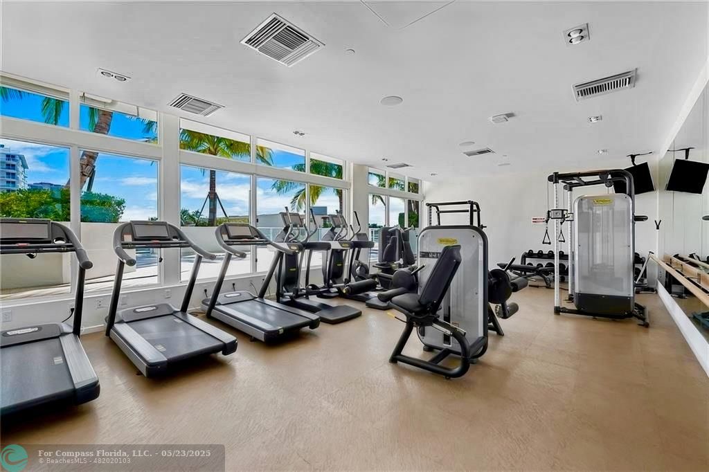 401 North Birch Road, Unit 415 Fort Lauderdale, FL 33304 - Photo 25 of 33 a view of a room with gym equipment