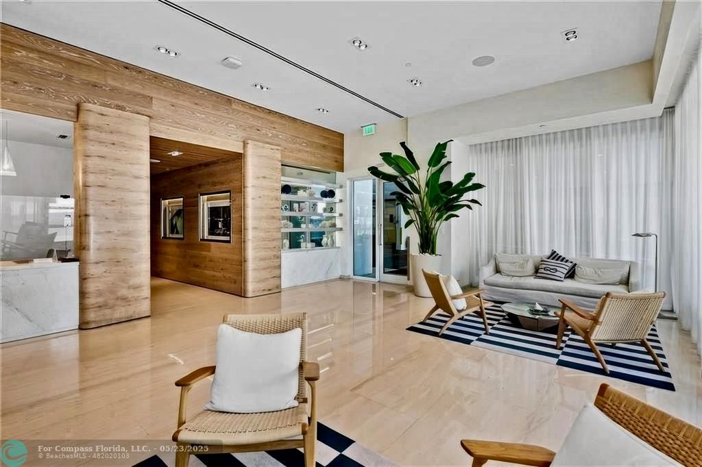 401 North Birch Road, Unit 415 Fort Lauderdale, FL 33304 - Photo 28 of 33 a living room with furniture flowerpot and wooden floor