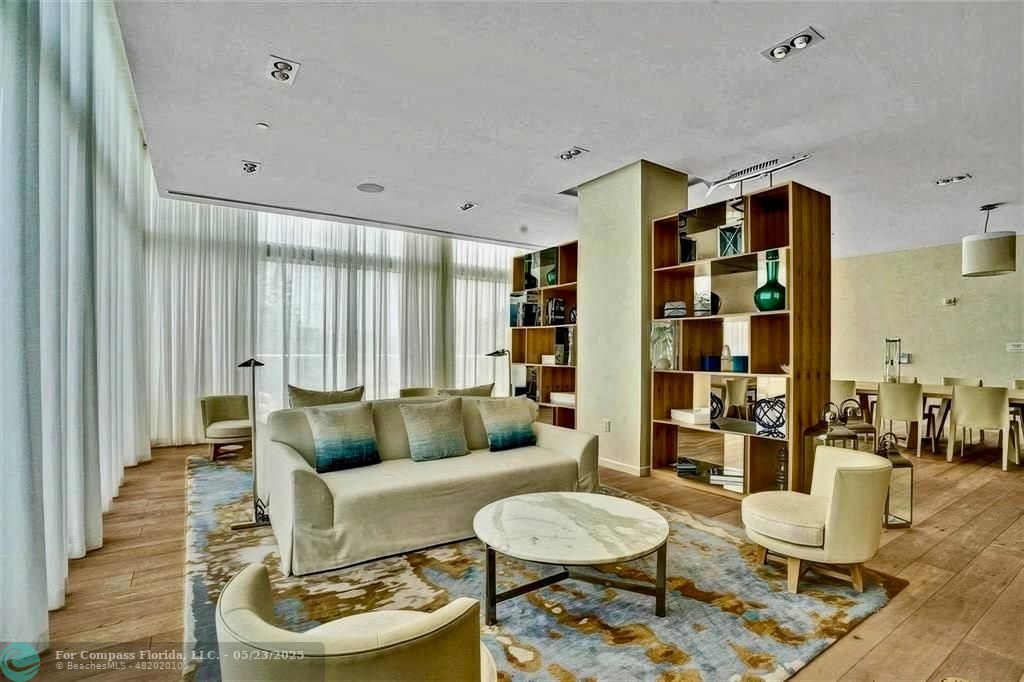 401 North Birch Road, Unit 415 Fort Lauderdale, FL 33304 - Photo 29 of 33 a living room with furniture and a large window