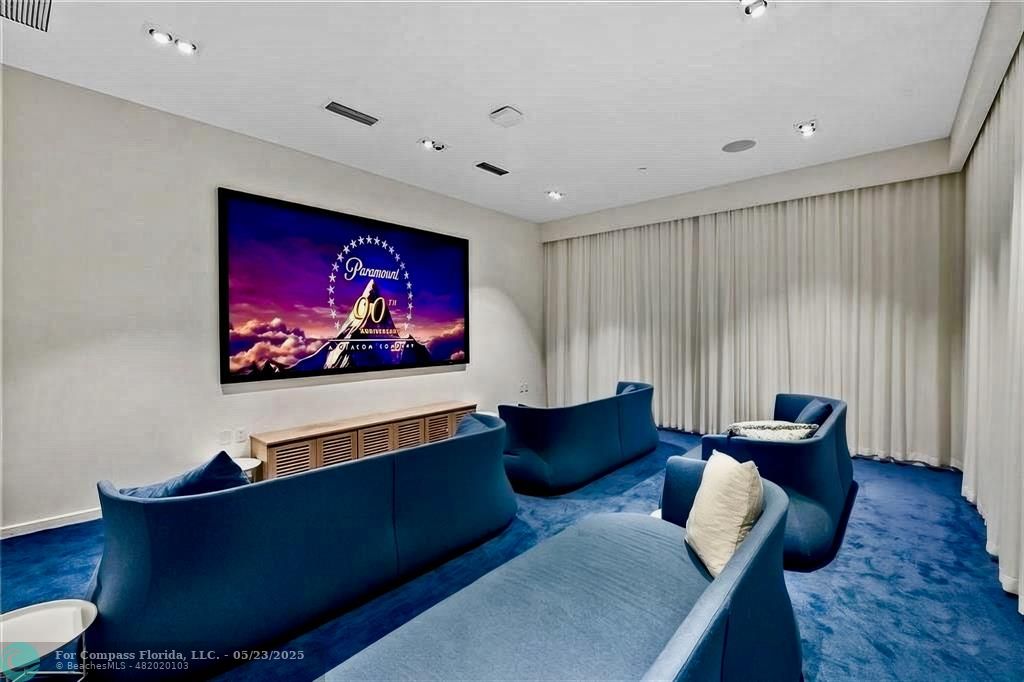 401 North Birch Road, Unit 415 Fort Lauderdale, FL 33304 - Photo 31 of 33 a living room with furniture and a flat screen tv