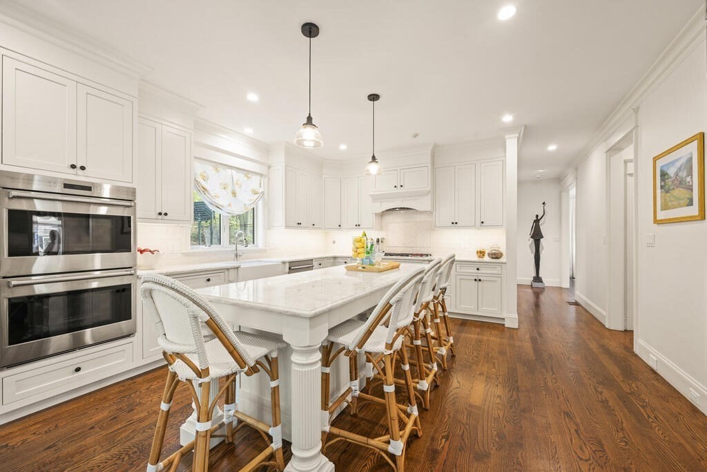 22 Richard Road Lexington, MA 02421 - Photo 13 of 42 a kitchen with stainless steel appliances kitchen island granite countertop a stove a sink and a refrigerator