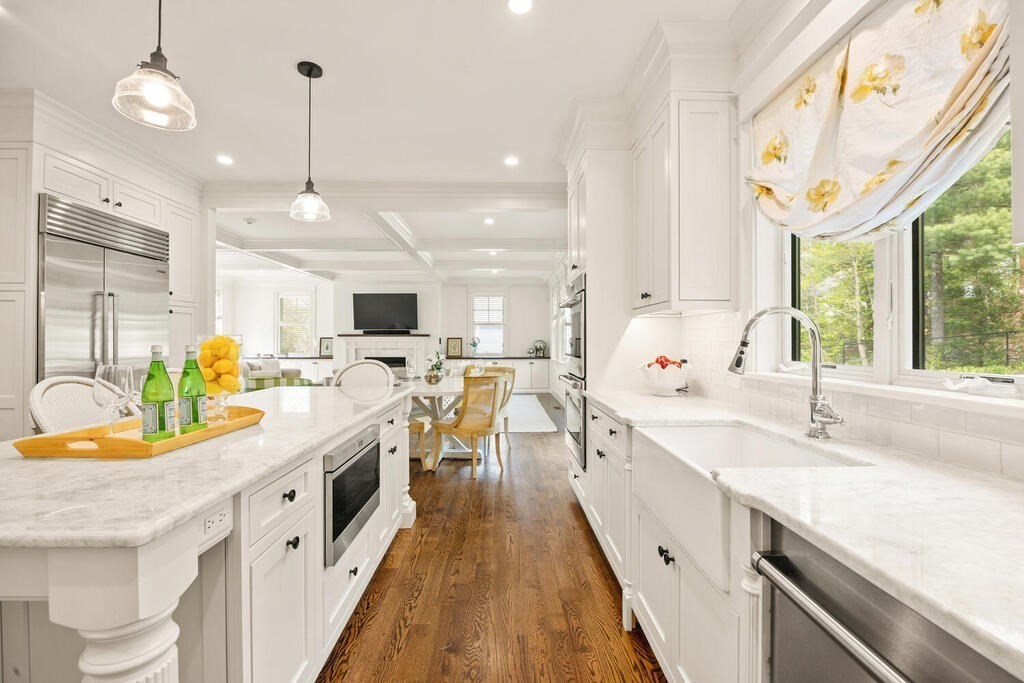 22 Richard Road Lexington, MA 02421 - Photo 16 of 42 a large kitchen with kitchen island a large counter space appliances and a large window