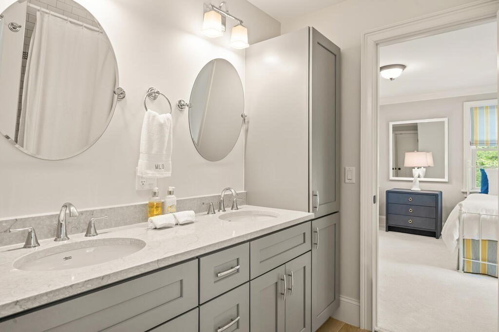 22 Richard Road Lexington, MA 02421 - Photo 25 of 42 a en suite bathroom with a double vanity sink and a mirror