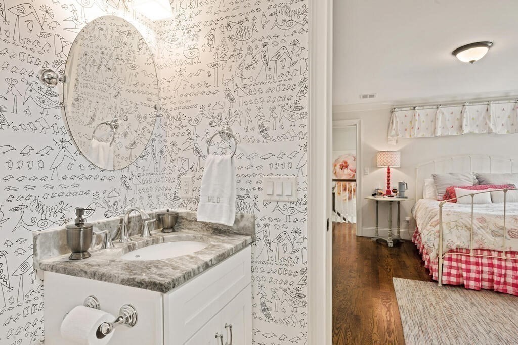 22 Richard Road Lexington, MA 02421 - Photo 29 of 42 a bathroom with a granite countertop sink a mirror and shower