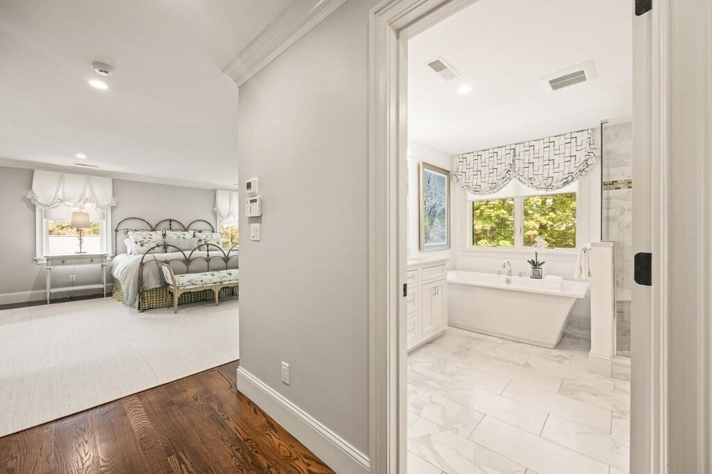 22 Richard Road Lexington, MA 02421 - Photo 30 of 42 a en suite bathroom with a tub double vanity and window