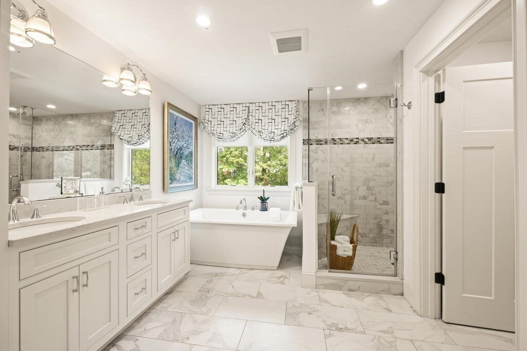 22 Richard Road Lexington, MA 02421 - Photo 33 of 42 a spacious bathroom with a double vanity sink a large mirror and shower