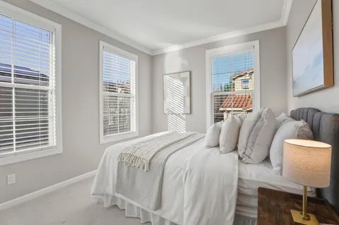 a bedroom with a bed and window