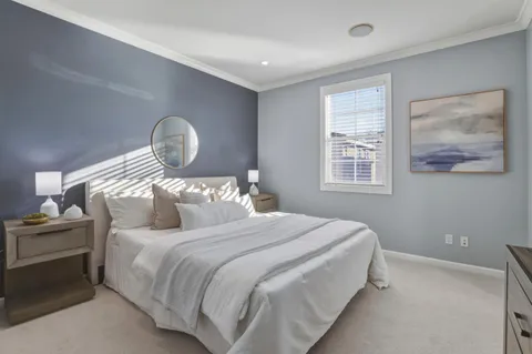 a bedroom with bed and a window