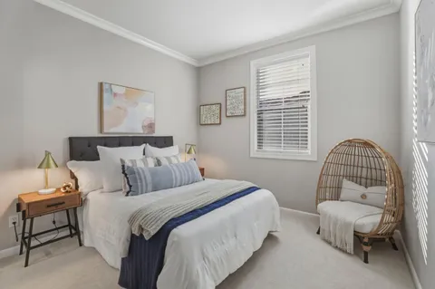 a bedroom with bed and a window