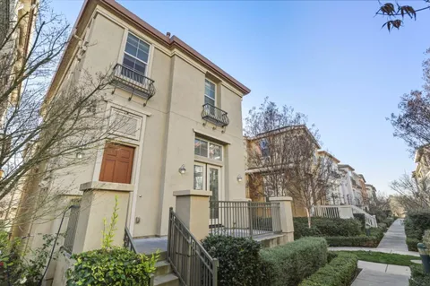 a view of a blue building with large windows
