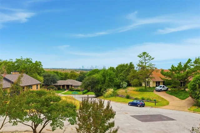 an aerial view of residential houses with yard and swimming pool