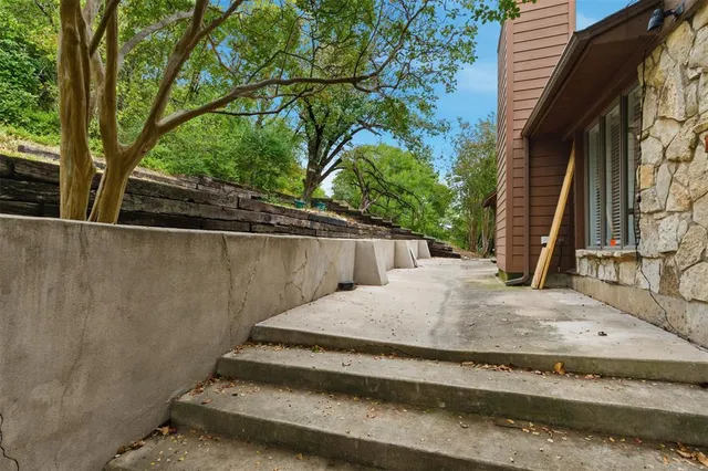 a view of a backyard with trees