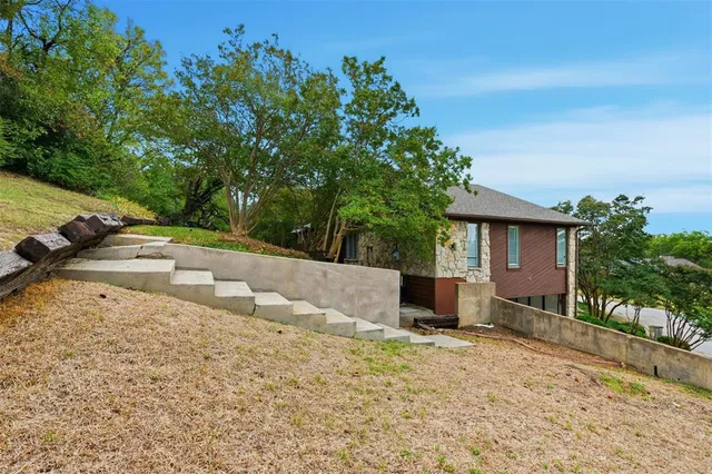a backyard of a house with lots of green space