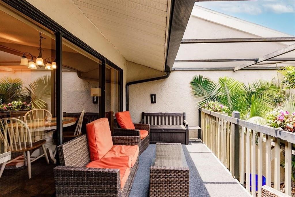 323 Bobby Jones Road, Unit 323 Sarasota, FL 34232 - Photo 3 of 10 a view of balcony with wooden floor