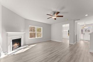 636 Bald Ridge Circle Demorest, GA 30535 - Photo 14 of 35 a view of an empty room with a fireplace and a window