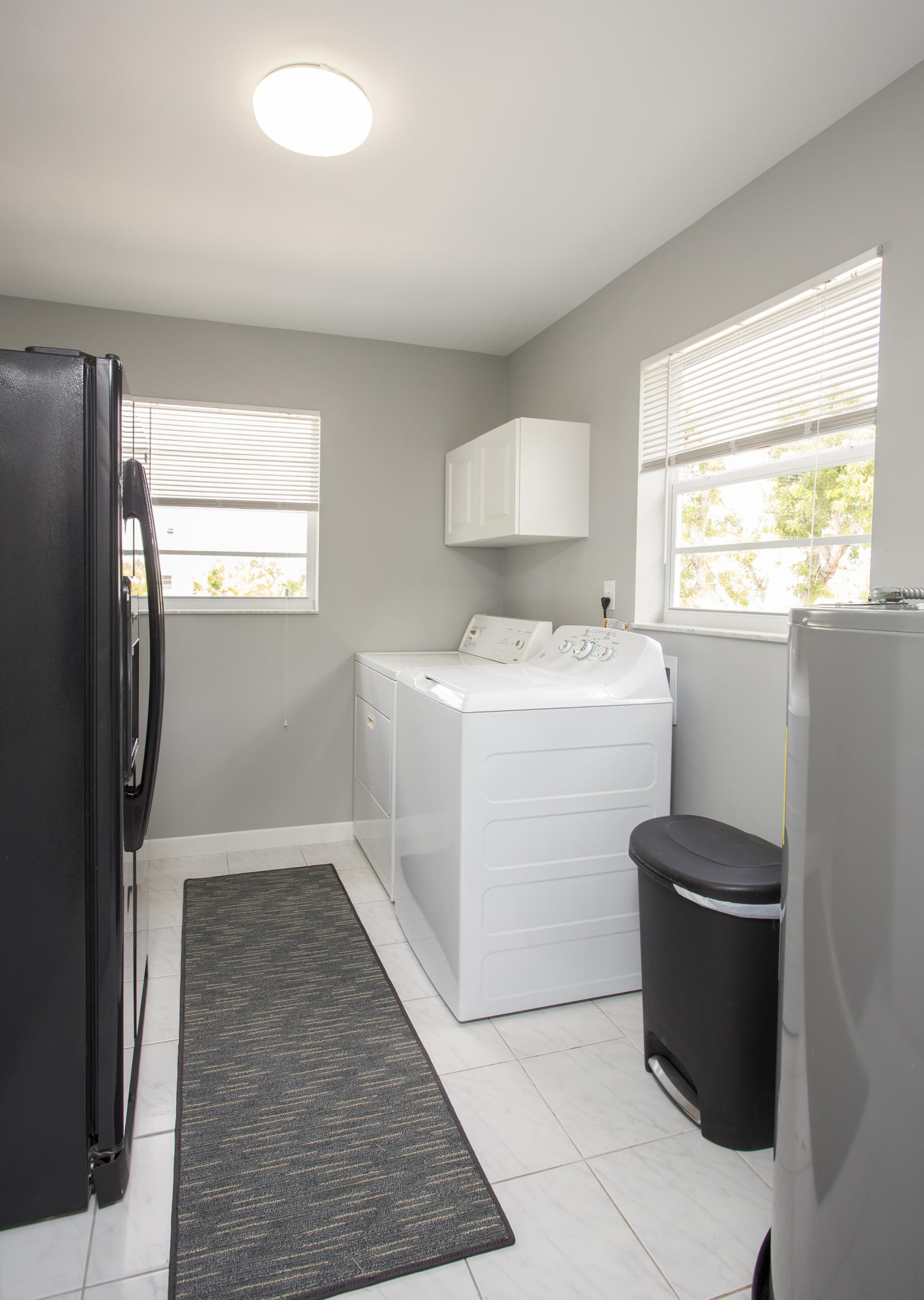 165 Cutlass Lane Cudjoe, FL 33042 - Photo 11 of 30 a utility room with cabinets washer and dryer