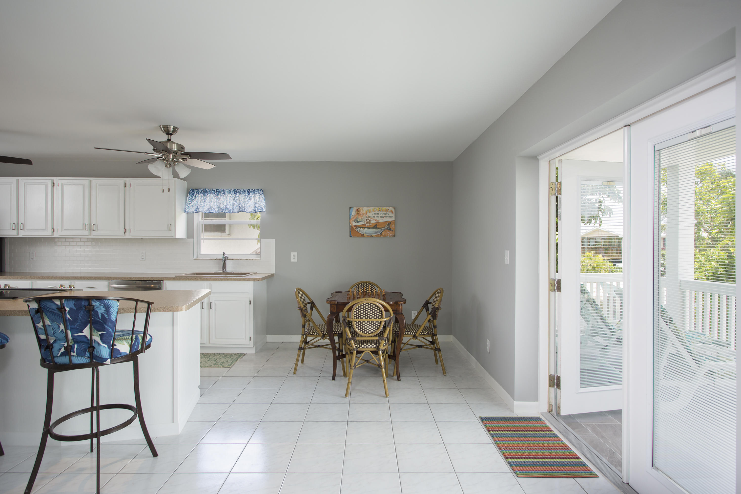 165 Cutlass Lane Cudjoe, FL 33042 - Photo 16 of 30 a dining room with furniture and a chandelier
