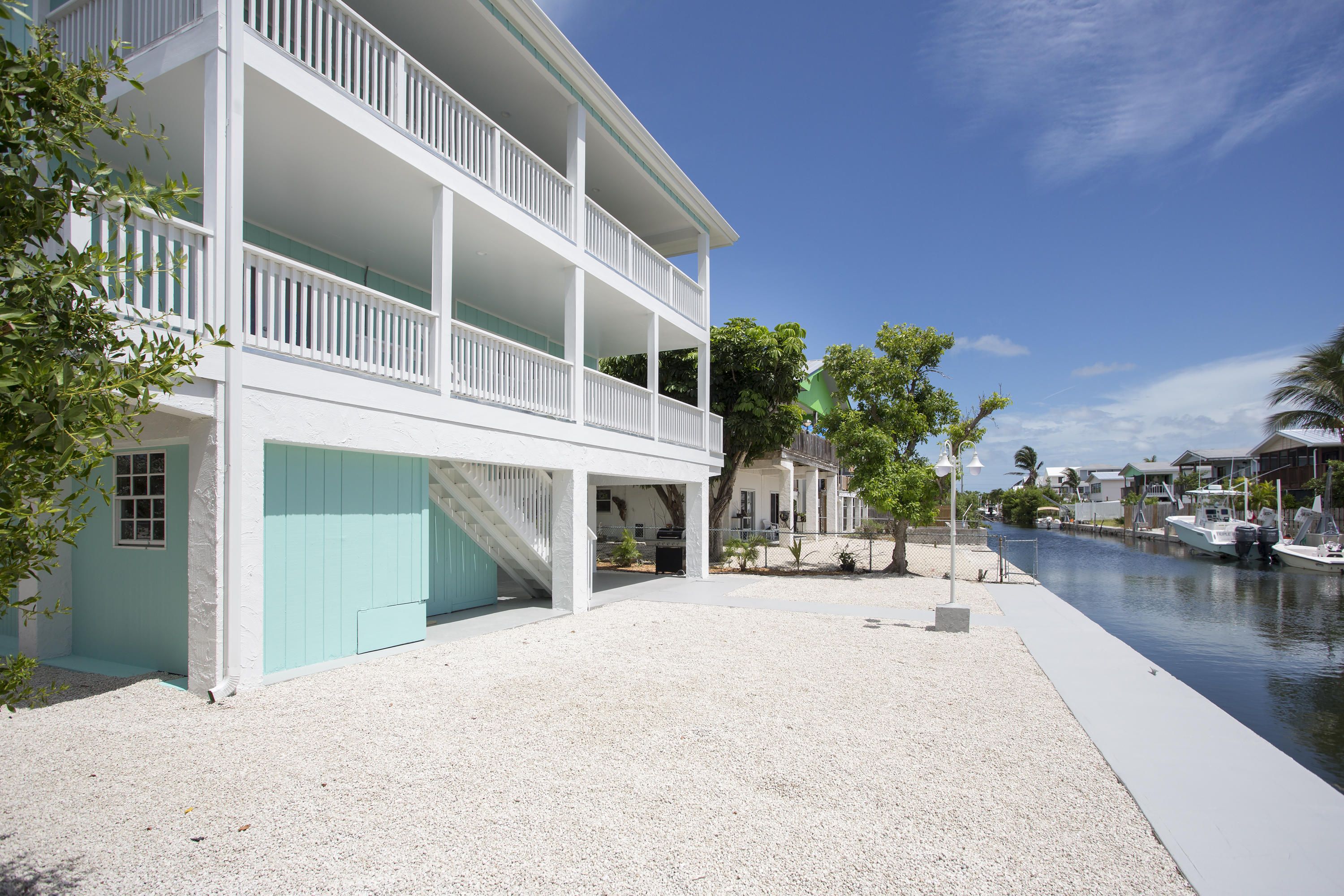 165 Cutlass Lane Cudjoe, FL 33042 - Photo 2 of 30 a view of a house with outdoor space and porch