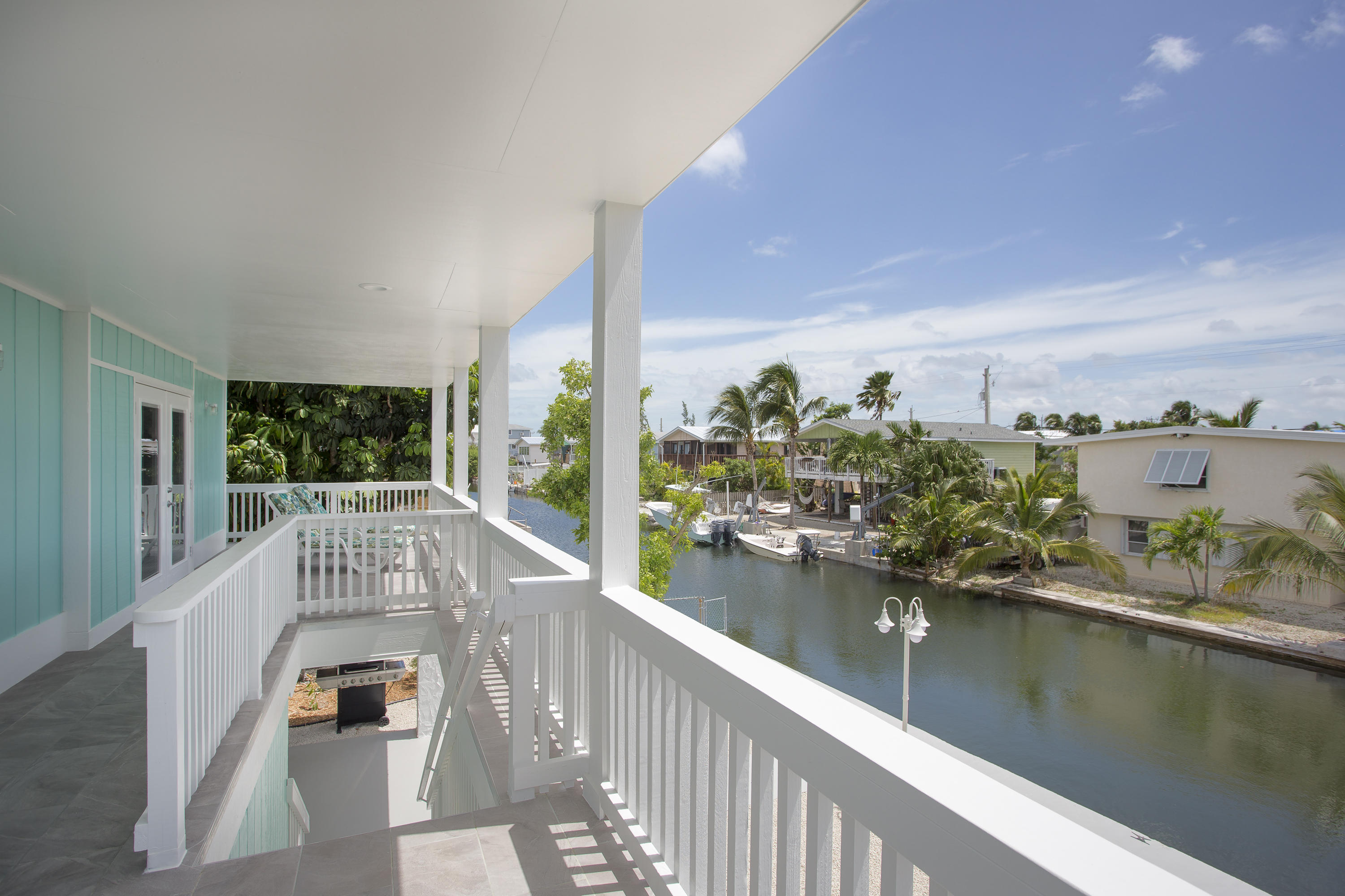 165 Cutlass Lane Cudjoe, FL 33042 - Photo 24 of 30 a view of a balcony with lake view and wooden floor
