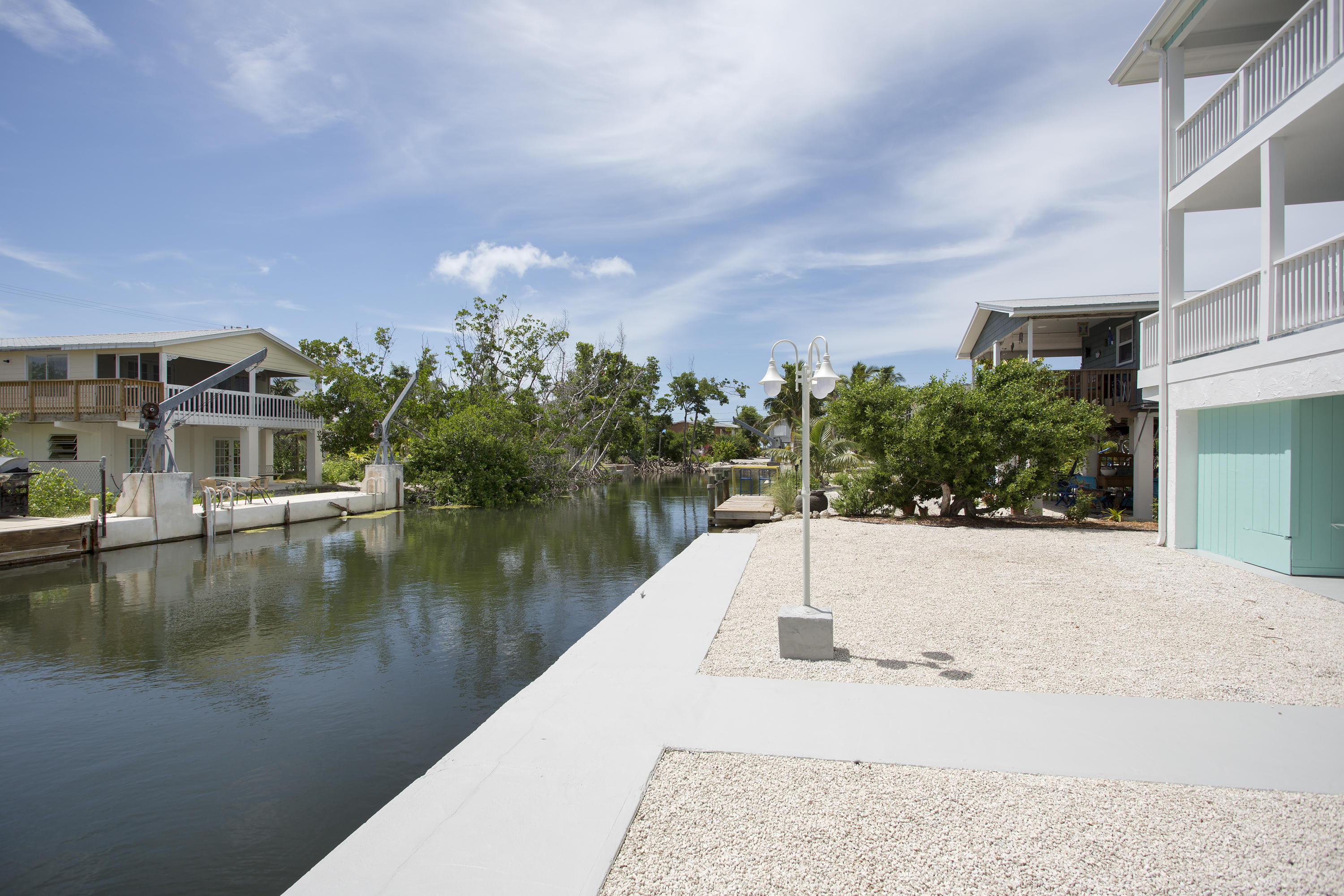 165 Cutlass Lane Cudjoe, FL 33042 - Photo 25 of 30 a view of a lake with a building in the background