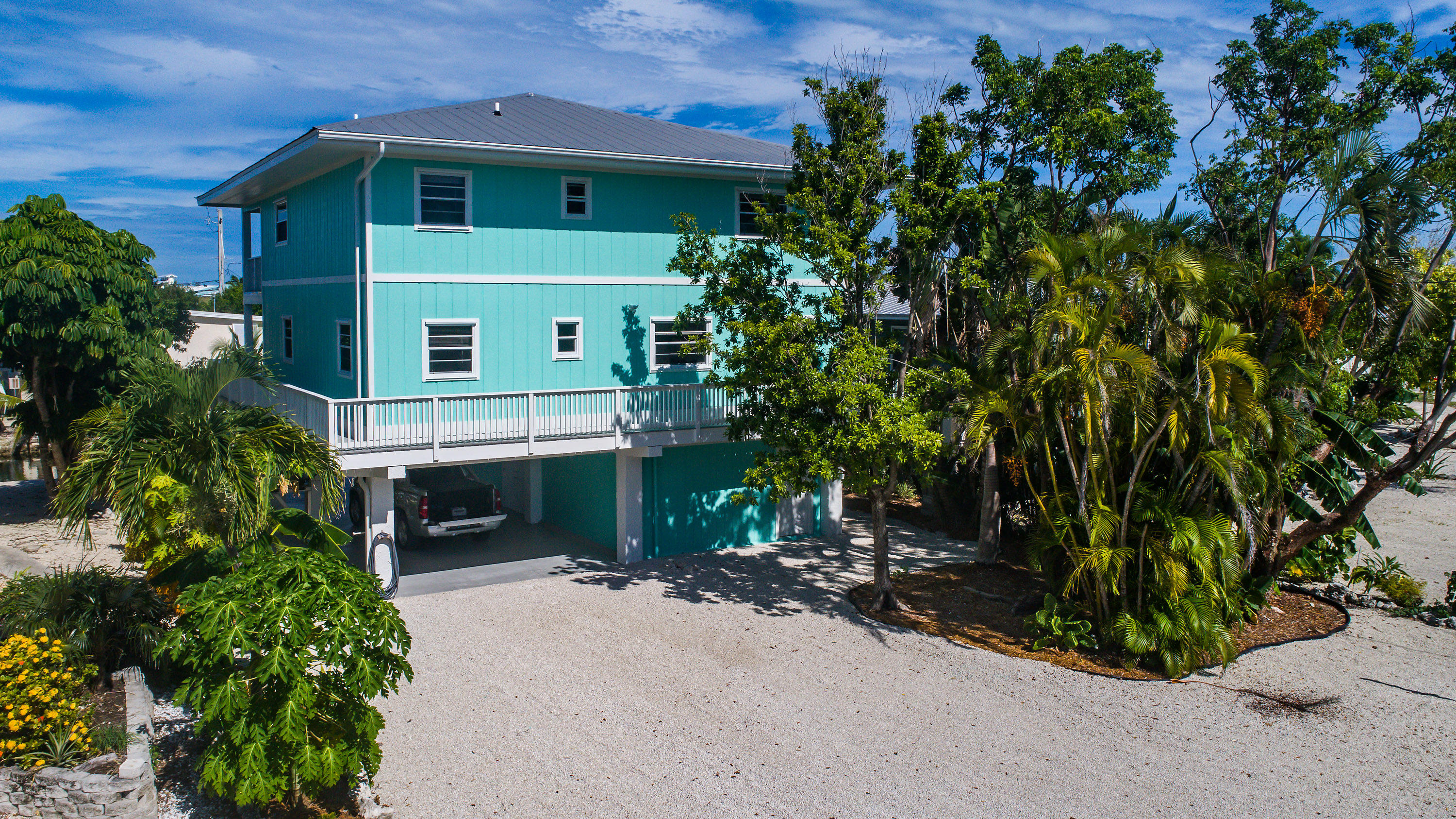 165 Cutlass Lane Cudjoe, FL 33042 - Photo 3 of 30 a front view of a house with a yard