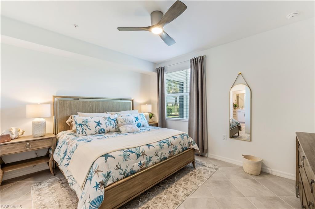 43985 Boardwalk Loop, Unit 2118 Punta Gorda, FL 33982 - Photo 11 of 32 a bedroom with a bed and a painting