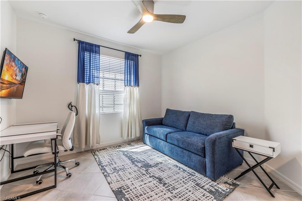 43985 Boardwalk Loop, Unit 2118 Punta Gorda, FL 33982 - Photo 13 of 32 a living room with furniture and a window