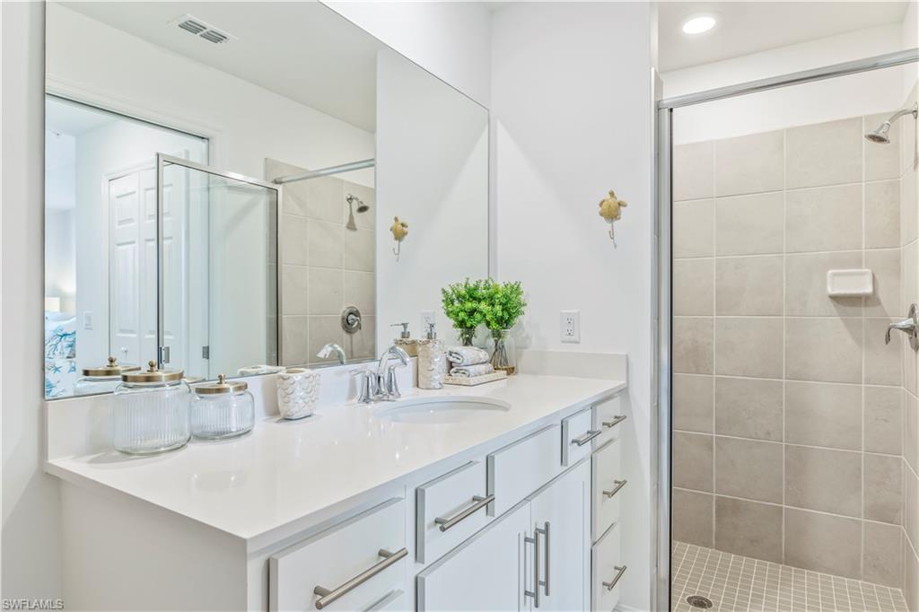 43985 Boardwalk Loop, Unit 2118 Punta Gorda, FL 33982 - Photo 15 of 32 a bathroom with a sink and a mirror