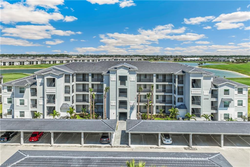 43985 Boardwalk Loop, Unit 2118 Punta Gorda, FL 33982 - Photo 17 of 32 a view of a building with a lot of windows