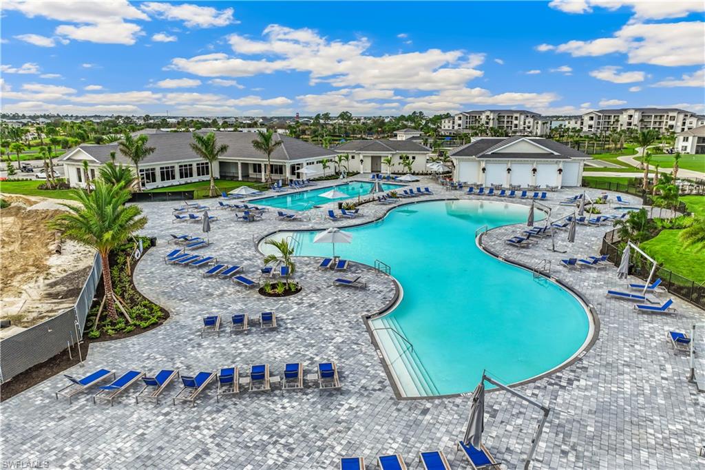 43985 Boardwalk Loop, Unit 2118 Punta Gorda, FL 33982 - Photo 20 of 32 a view of a swimming pool with lounge chair