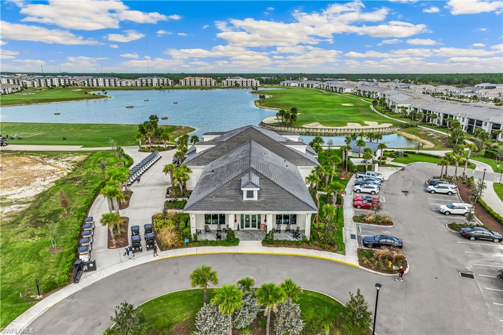43985 Boardwalk Loop, Unit 2118 Punta Gorda, FL 33982 - Photo 27 of 32 an aerial view of multiple houses with a swimming pool
