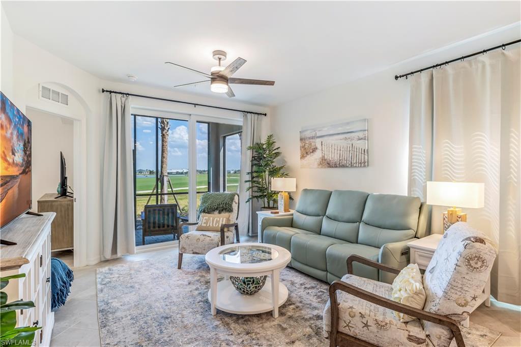 43985 Boardwalk Loop, Unit 2118 Punta Gorda, FL 33982 - Photo 4 of 32 a living room with furniture and a large window