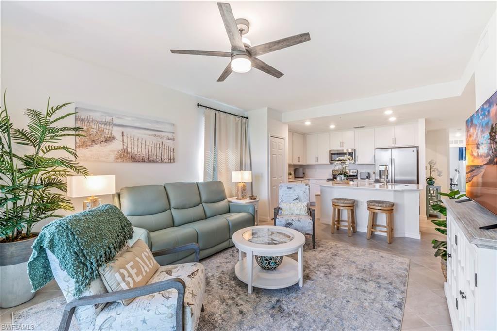 43985 Boardwalk Loop, Unit 2118 Punta Gorda, FL 33982 - Photo 5 of 32 a living room with furniture and a large window