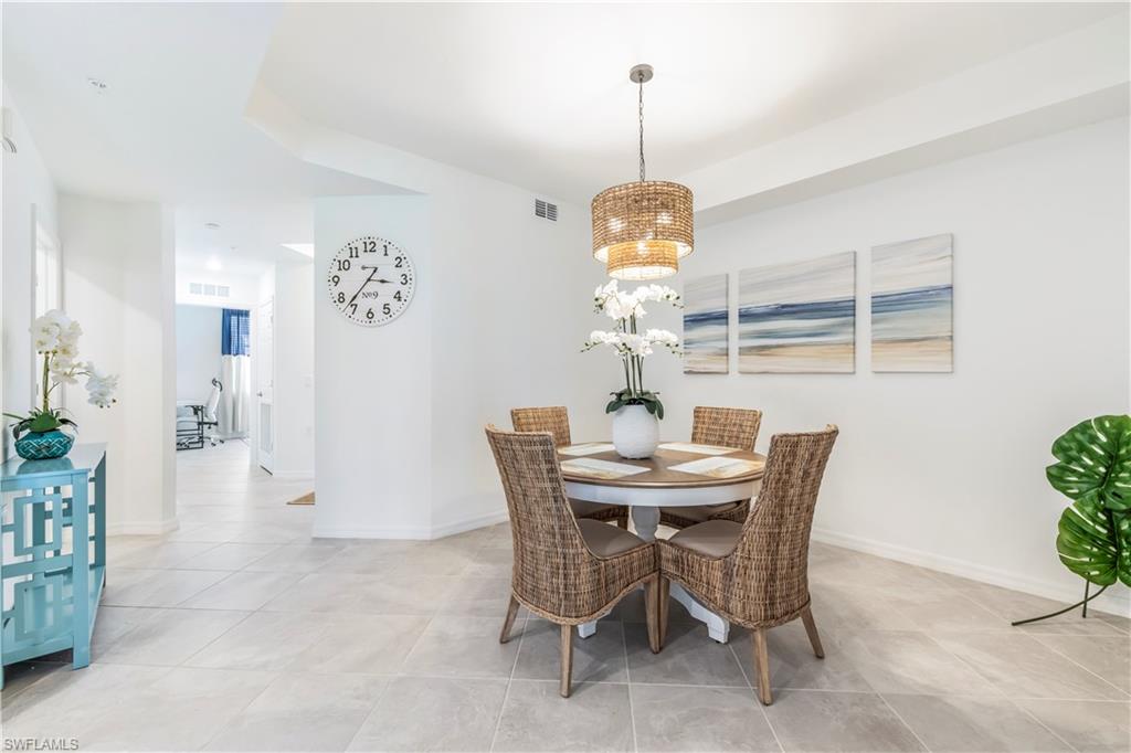 43985 Boardwalk Loop, Unit 2118 Punta Gorda, FL 33982 - Photo 9 of 32 a view of a dining room with a table and chairs