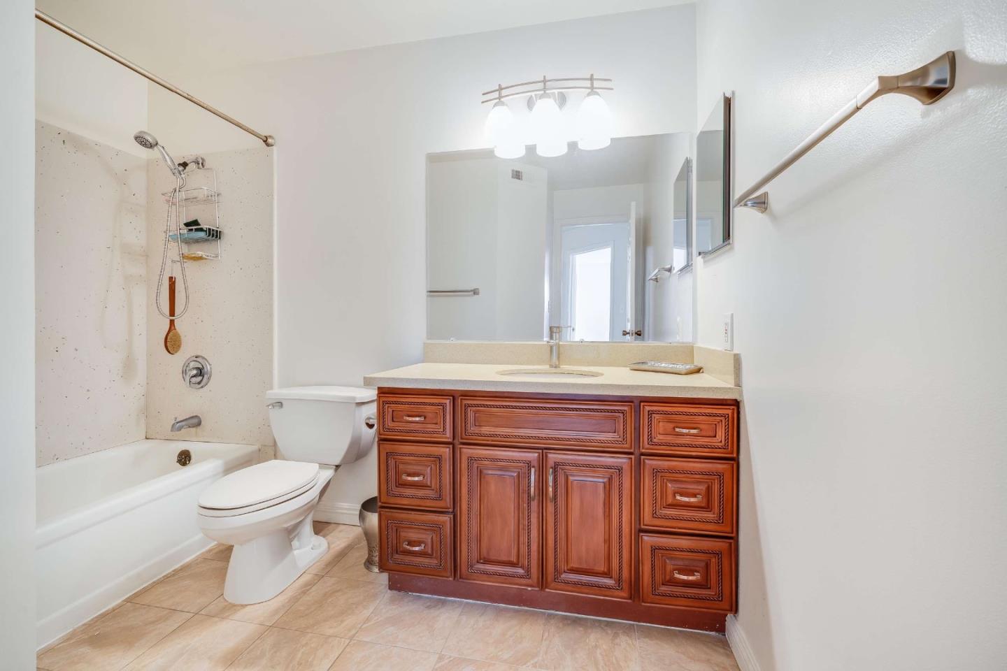 22135 Sevilla Road, Unit 47 Hayward, CA 94541 - Photo 15 of 37 a spacious bathroom with a granite countertop toilet a sink and a bathtub