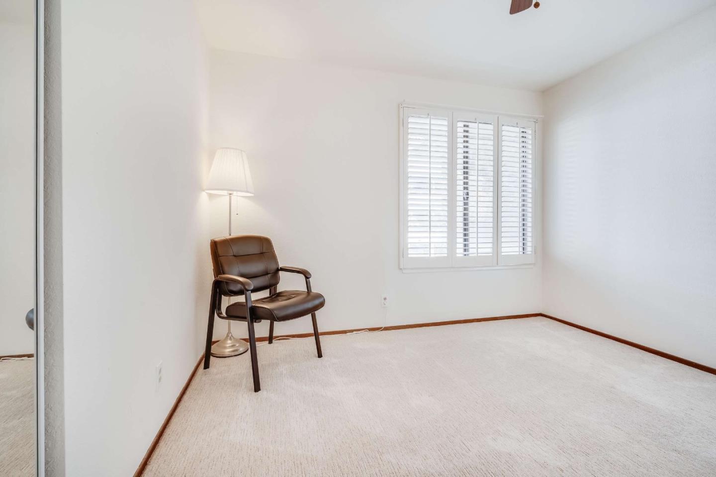 22135 Sevilla Road, Unit 47 Hayward, CA 94541 - Photo 18 of 37 an empty room with windows and lounge chair