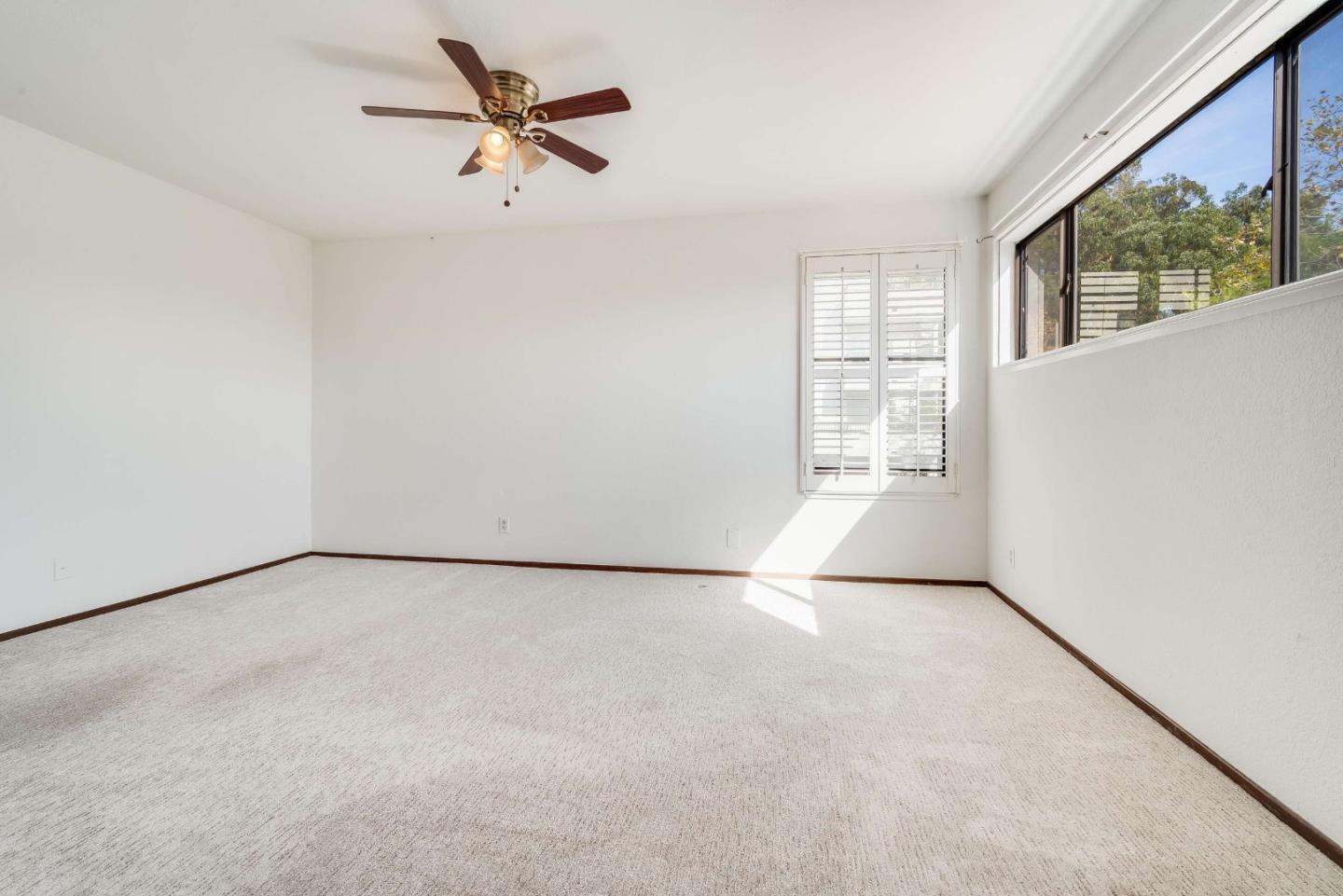 22135 Sevilla Road, Unit 47 Hayward, CA 94541 - Photo 22 of 37 an empty room with windows and fan