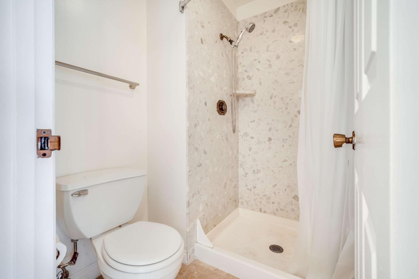 22135 Sevilla Road, Unit 47 Hayward, CA 94541 - Photo 23 of 37 a white toilet next to a bathroom