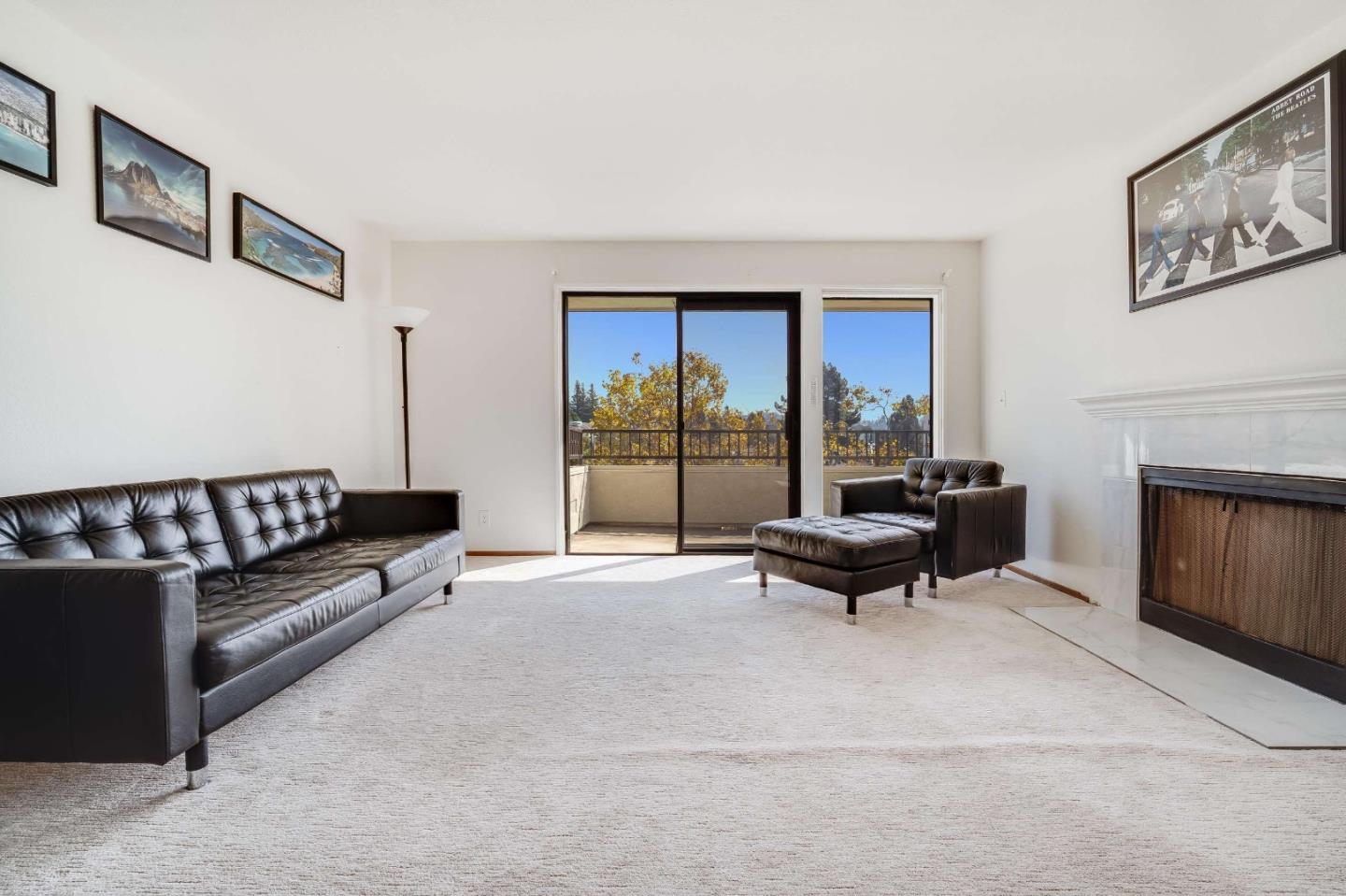 22135 Sevilla Road, Unit 47 Hayward, CA 94541 - Photo 6 of 37 a living room with furniture a large window and a fireplace