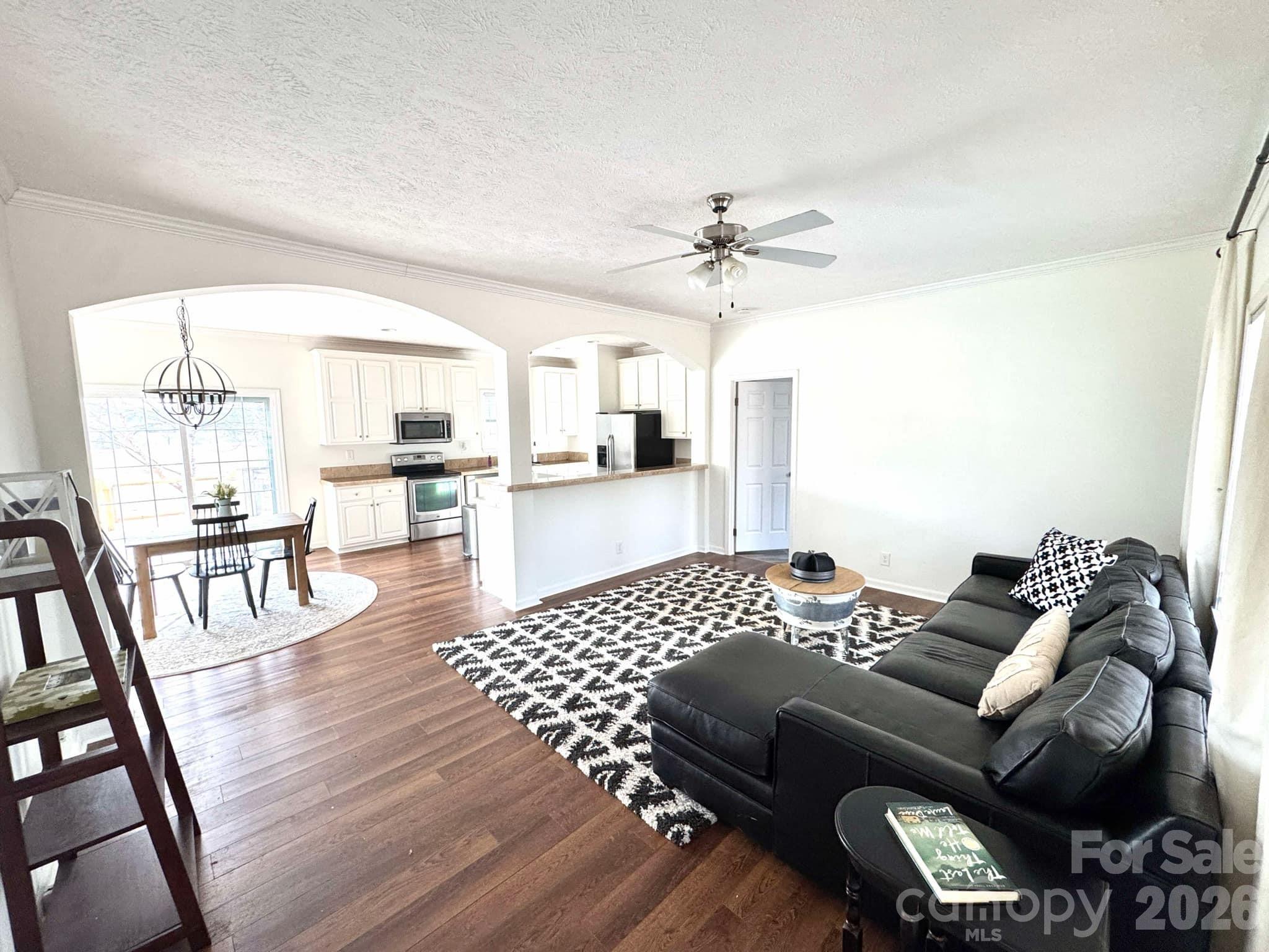 49428 Quail Trail Road Norwood, NC 28128 - Photo 2 of 13 a living room with furniture and a wooden floor