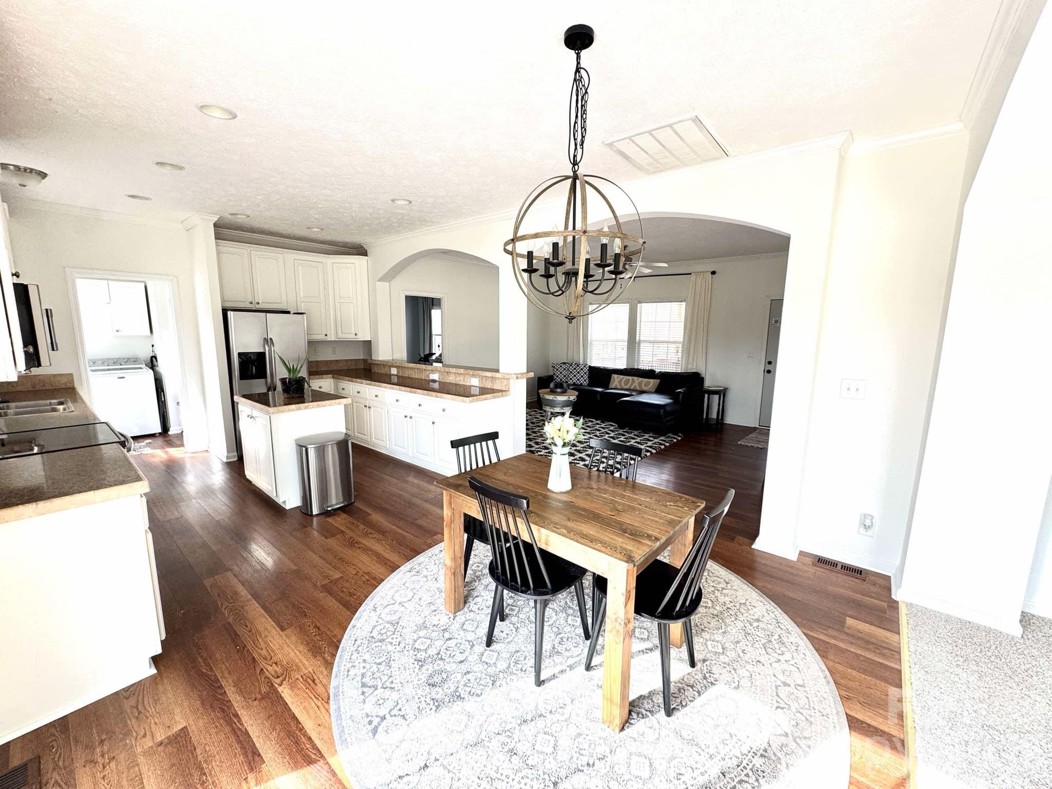 49428 Quail Trail Road Norwood, NC 28128 - Photo 5 of 13 a living room with lots of furniture and kitchen view
