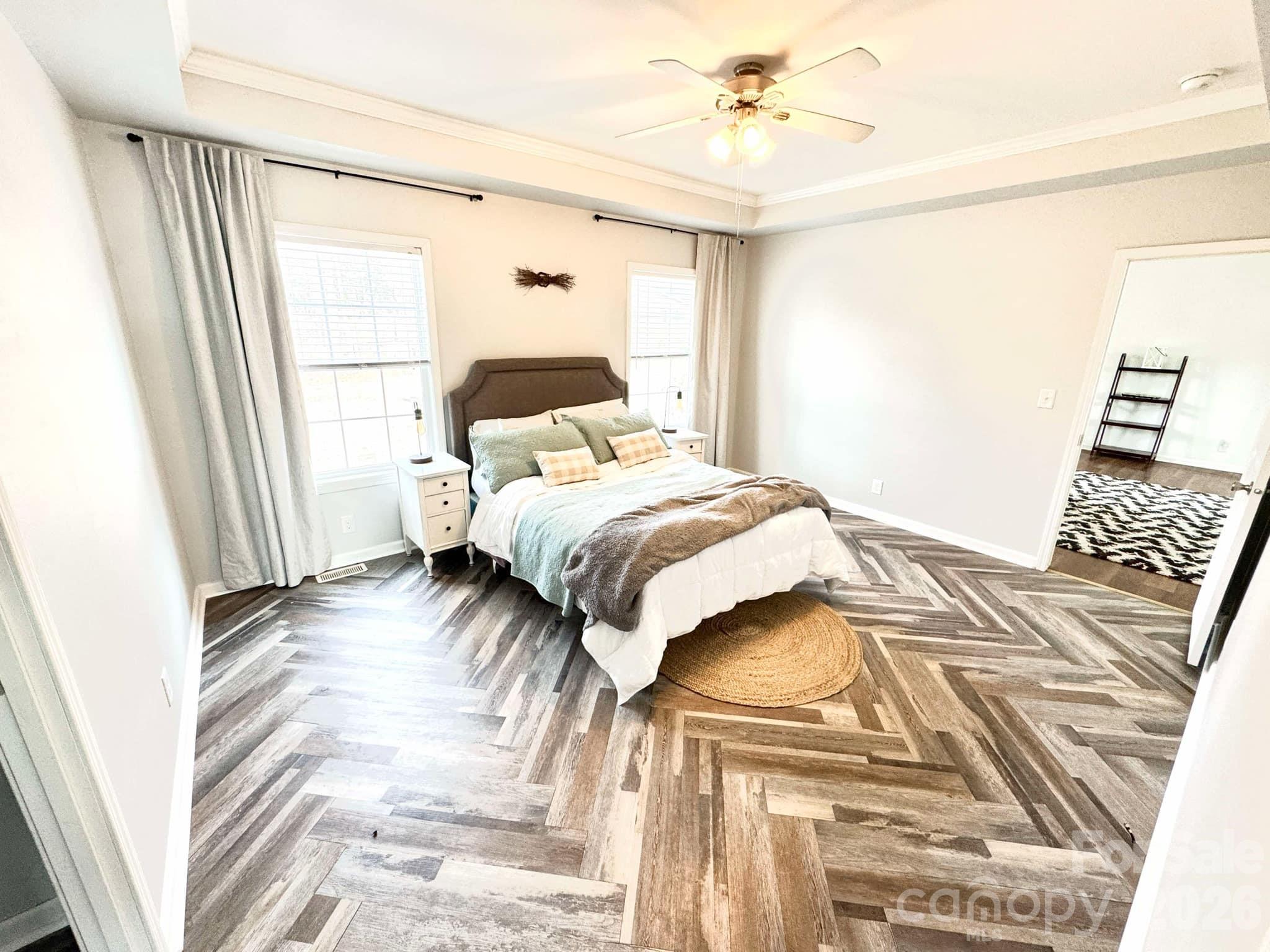 49428 Quail Trail Road Norwood, NC 28128 - Photo 9 of 13 a bedroom with a bed and a window