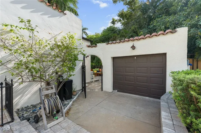 a backyard view with a seating space