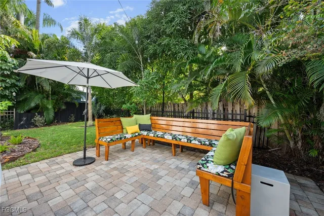 an aerial view of a house with a yard and garden