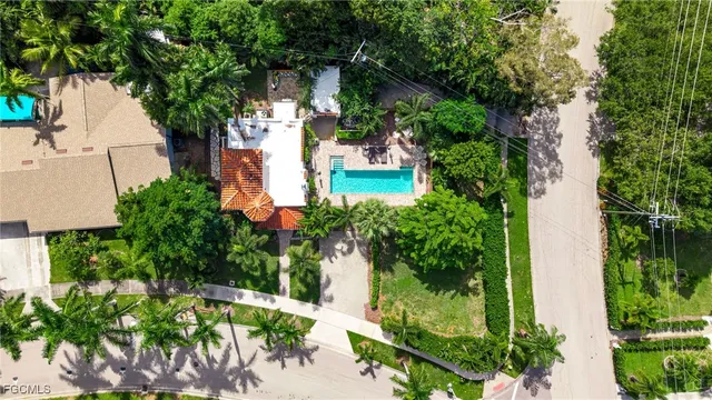 an aerial view of a house with a yard and garden