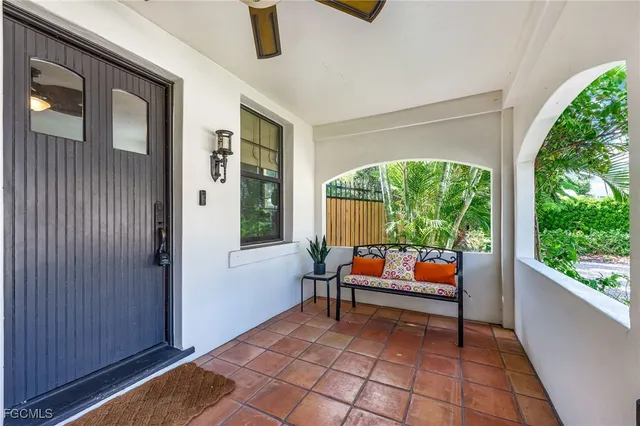 a outdoor space with the couches and dining table with wooden floor